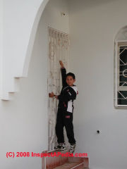 No stair landing at egress door, Rabat Morocco (C) Daniel Friedman at InspectApedia.com