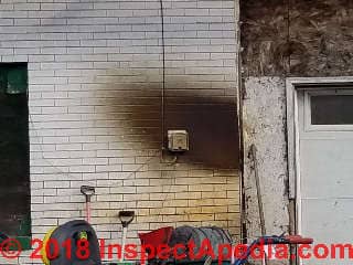 Oily soot at a direct vent or sidewall vent exhaust at a building in northern Minnesota (C) Daniel Friedman at InspectApedia.com