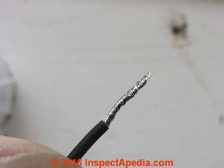 Multi-strand wire  from the light fixture needs preparation  before it can be inserted into the twist-on connector (C) Daniel Friedman