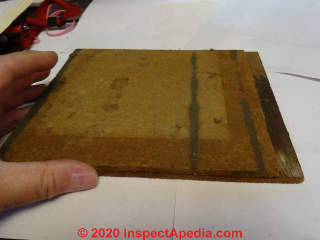 Brushed wood cedar shingle siding bonded to a fiberboard backer (C) InspectApedia.com SmallwoodK