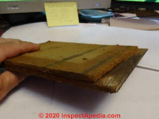 Brushed wood cedar shingle siding bonded to a fiberboard backer (C) InspectApedia.com SmallwoodK