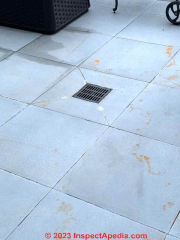 water leak on exterior stone wall of patio (C) InspectApedia.com Alex