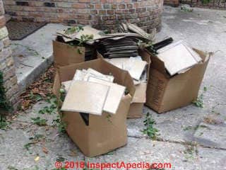 Boxes of unidentified floor tiles possibly with asbestos (C) InspectAPedia LW