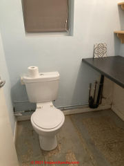 Old floor tile in UK - may contain asbestos (C) InspectApedia.com FlowerPower