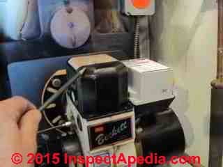 Photograph of oil burner pointing to the transformer used for ignition (C) Daniel Friedman
