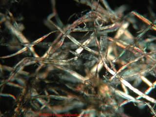 Cellulose insulation combining shredded paper and plant fibers, probably wood (C) Daniel Friedman & KK at InspectApedia.com