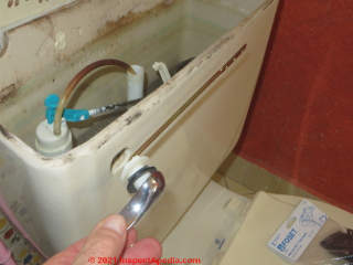 New toilet flush handle and lever (C) Daniel Friedman at InspectApedia.com