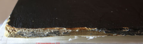 Unidentified board product used as a painting base, paper-based (C) InspectApedia.com Gianatta