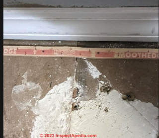 MDF subfloor with wheel logo stamp (C) InspectApedia.com NikkiSmirl