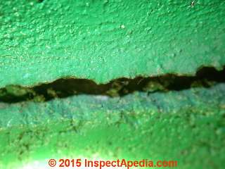 Paint on dirt in an old wall crack © Daniel Friedman at InspectApedia.com
