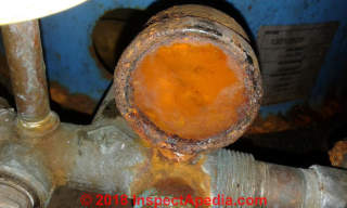 Leaky water pressure gauge needs to be replaced before it causes a building flood (C) Inspectapedia.copm 